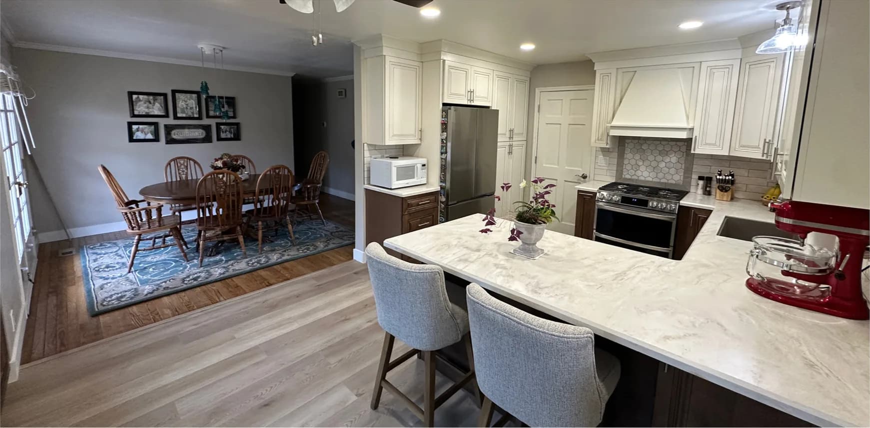 After: kitchen remodel in Utah, from a closed-off kitchen to an open layout connected to the dining room